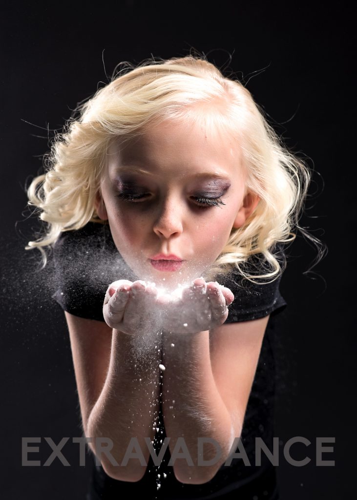Utah Dance Photographer Purple Moss Teams with Extravadance Studio dancer blowing flour